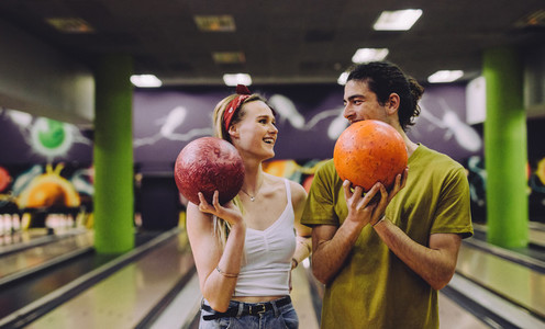 Dating couple enjoying bowling together