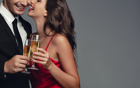 Romantic couple celebrating with champagne