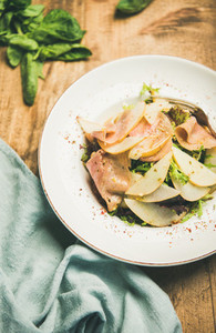 Summer salad with smoked turkey ham and pear selective focus