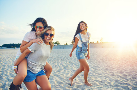 Three cheerful female friends on summer vacation