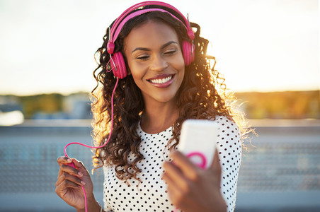 Attractive woman listening to music on her mobile