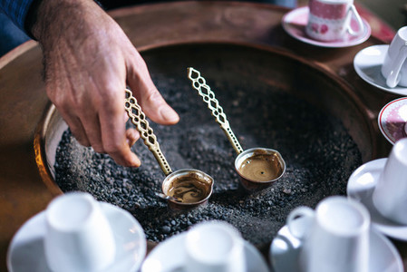 A man make Turkish coffee