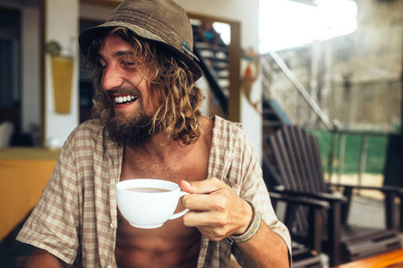 bearded guy drinking coffee