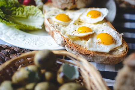 Quail eggs on bread with butter