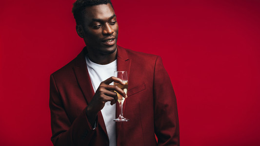 Stylish african man with champagne