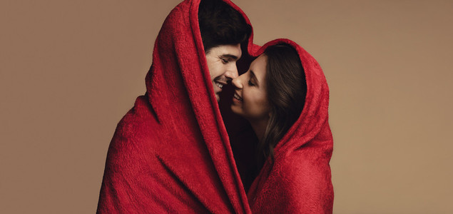 Romantic couple under a blanket