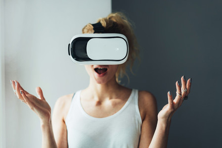 Woman in VR headset looking up