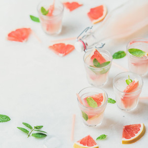 Cold refreshing alcohol cocktail with fresh grapefruit  square crop