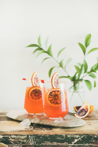 Glasses of Aperol Spritz alcohol cocktail with orange and ice
