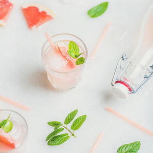 Cold refreshing summer alcohol cocktail with fresh grapefruit and mint