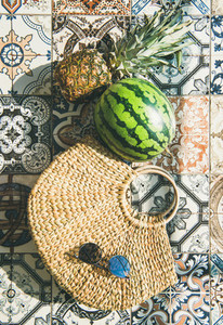 Summer lifestyle background with fruits and straw bag  vertical composition