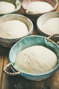 Sourdough for baking homemade bread in baskets  selective focus