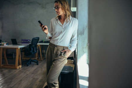Female entrepreneur using mobile phone