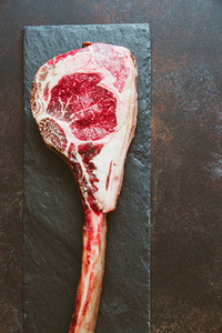 Top view of raw dry aged marble beef steak Tomahawk  Flat lay  cooking concept