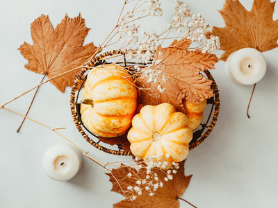Top view of small pumpkins on a wooden board decorated Autumn ornate The concept of Thanksgiving and Autumn