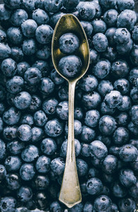 Fresh huckleberry full frame food background  The concept of healthy food and summer eating