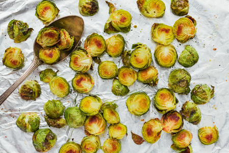Top view of roasted brussel sprouts on a foil  The concept of healthy vegetarian eating