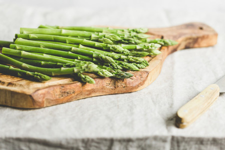 Fresh asparagus on a wooden cutting board Preparation vegetarian healthy food
