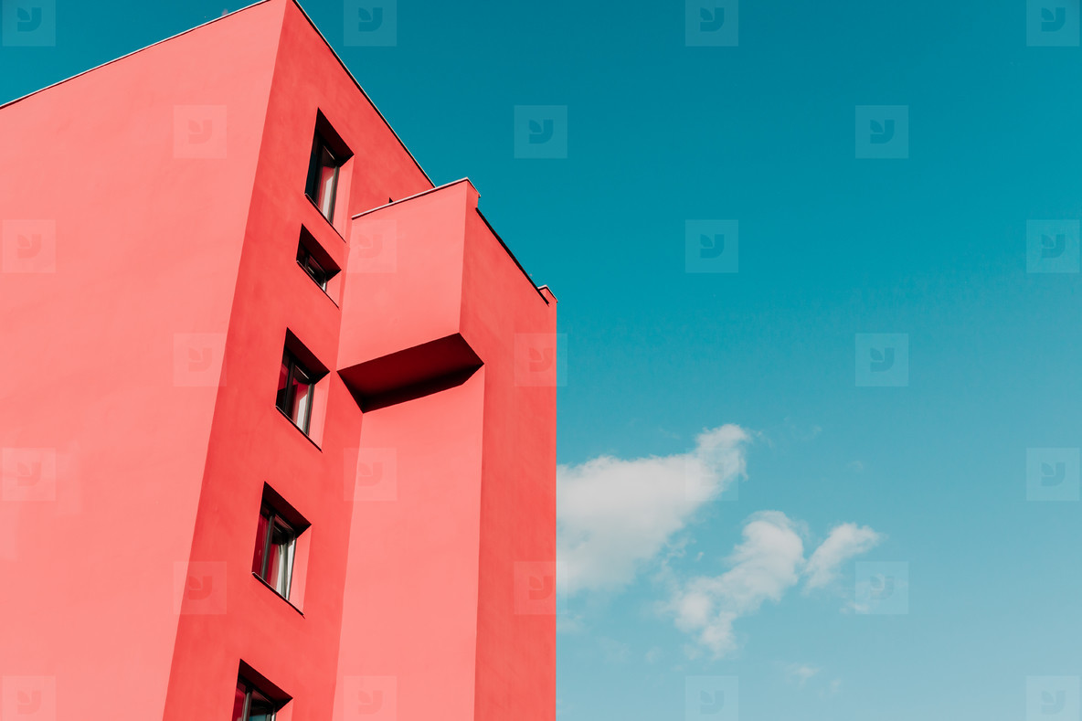 View from below on a pink modern house and sky. Vintage pastel colors, minimalist concept
