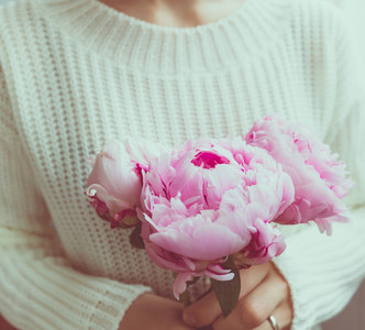 Girl holds beautiful bouquet pink peonies from The concept of celebration and love