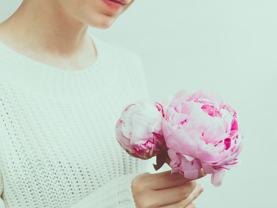 Girl holds beautiful bouquet pink from peonies  The concept of celebration and love
