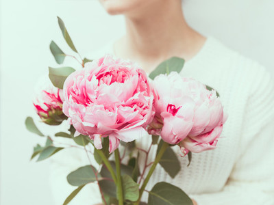 Girl holds beautiful bouquet pink from peonies The concept of celebration and love