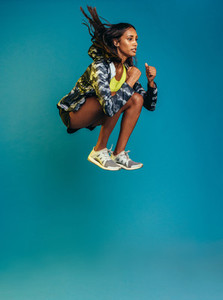 Sports woman doing jumping workout