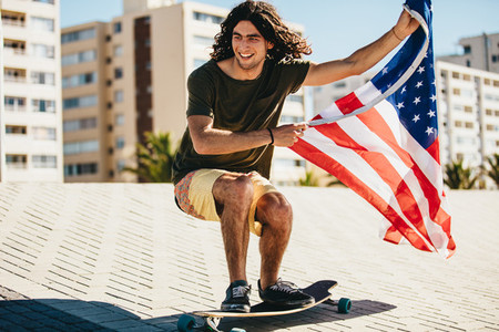 Man skateboarding with USA flag
