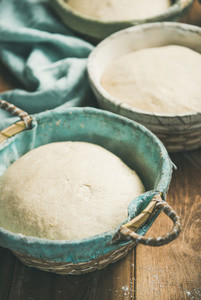 Sourdough for baking homemade wheat flour bread in baskets