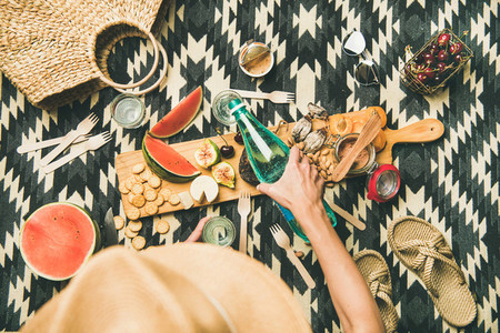 Summer beach picnic setting with charcuterie and fruits copy space