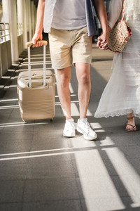 asian traveler couple with suitcase