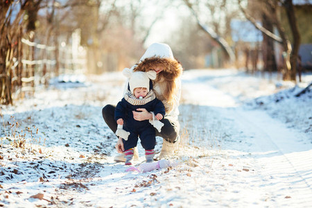 mother and daughter in the snowy countryside