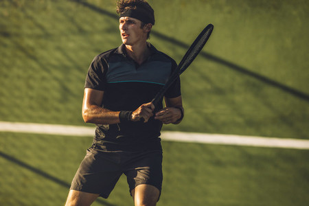 Tennis player practicing tennis on a club court