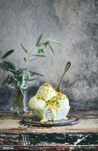 Bowl of homemade pistachio ice cream on kitchen counter