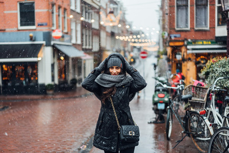 girl in the street in the rain