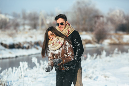Happy couple in snow park