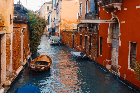 Venetian channel with ancient houses and boats