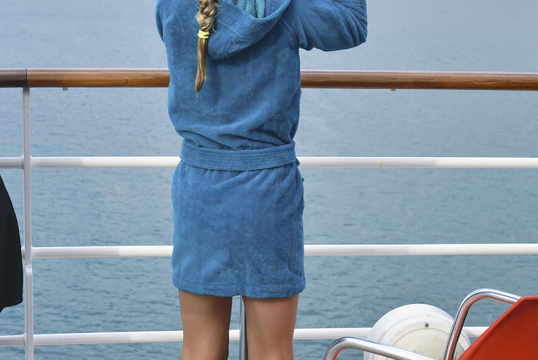 Curious girl on cruise ship looking through viewfinder at ocean #01