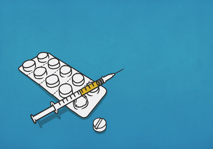 Syringe and blister pack of pills 01