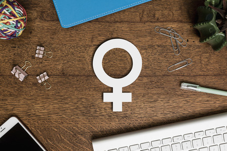 View from above paper female symbol on wooden desk 01