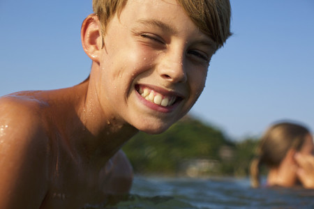Portrait happy carefree boy swimming in lake 01