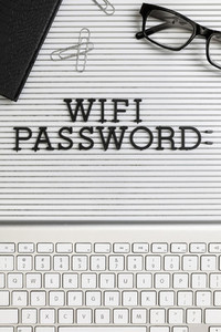 View form above Wifi Password on desk above computer keyboard 01