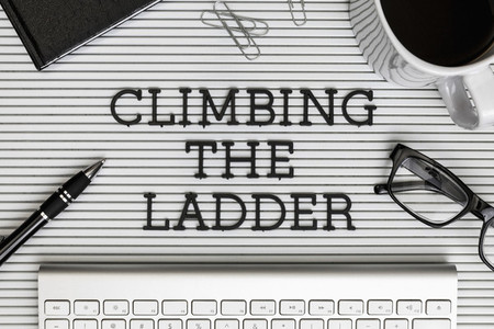 View from above Climbing the Ladder text on desk 01