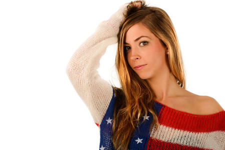 Beautiful blonde girl wearing a sweater with the flag of United