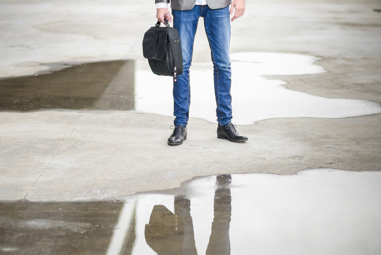 Young businessman near a office building