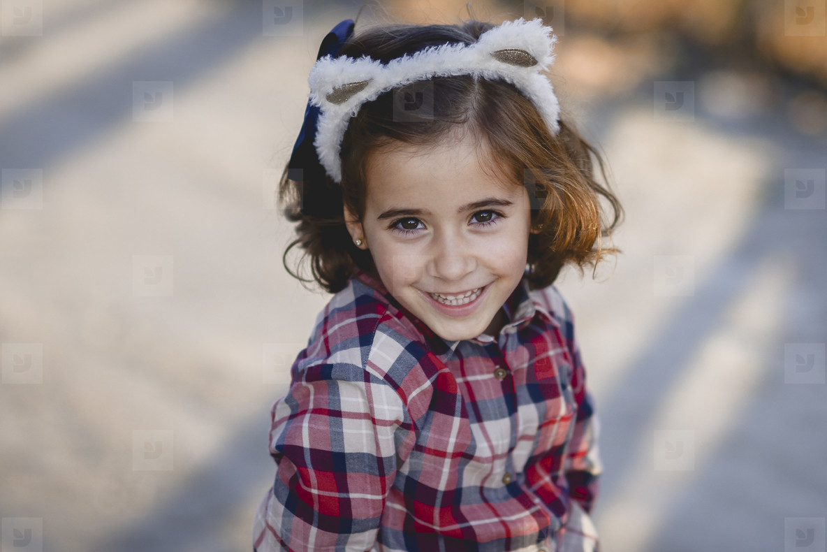 Adorable little girl smiling outdoors