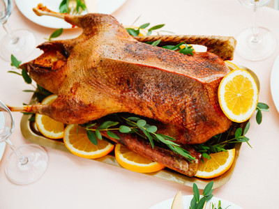 Roasted goose with oranges on a golden tray for celebrate event  Thanksgiving or Christmas family dinner
