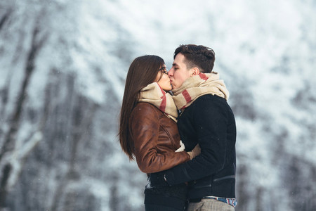 Happy couple in snow park