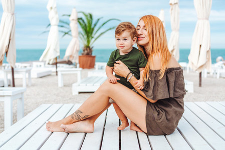 Mom and her little son on the beach on vacation