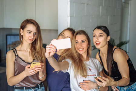 girls take selfy on the phone
